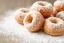 Placeholder: fresh old-fashioned mini doughnuts completely covered in powdered sugar