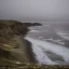 Placeholder: loneliness, emptiness, darkness, remoteness, cliff face on the coastline, storm waves