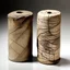Placeholder: two clay cylinders covered with etchings in a strange language. small and fragile, with large cracks running down their sides