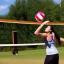 Placeholder: An young athletic woman playing volleyball.