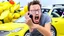 Placeholder: guy in hurricane arguing on phone next to his kia sportage made out of lemons