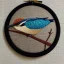 Placeholder: exquisite kingfisher in embroidery hoop, intricate, highly detailed, linen and wood backdrop