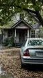Placeholder: A car abandoned in front of an old house covered with tree leaves and branches after a severe flooding a lot of damages