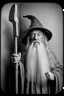 Placeholder: Gandalf with crowbar taking serie of BW photos inside photo booth.