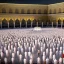 Placeholder: The scene in Mecca: People wearing white Ihram clothes, men without head coverings, women with veils, circumambulating around the Kaaba, and above them are transparent white spirits of children, men, and women with wings revolving around the Kaaba.