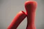 Placeholder:  red ribbed rubber dildo