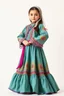 Placeholder: full body 7years old girl ,simple background, full body of very pretty little girl in azeri dance wearing A long underdress or shirt, often made of silk,A fitted, often velvet or brocade, jacket worn over the shirt.Wide, bell-shaped skirts are worn, often long and layered to create beautiful movements while dancing, with a long lace scarf at back of her head,in relax pose looking at camera.