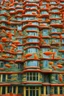 Placeholder: A crazy surreal incandescent building with flying fishes by artist "Sandy Skoglund",by artist "Hundertwasser",by artist "Victor Enrich"