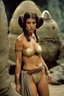 Placeholder: Anna Castillo in princess Leia's slave costume of the Return of the Jedi, close to Jabba the Hutt.