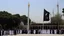 Placeholder: black flag raised at razavi shrine in mashhad echoing prophetic hadith about khorasan,