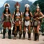 Placeholder: [photo from the TV series Sandokan (1976)] Barbarian Diplomacy led by three viking women in armour, with no inhibitions. Frida Kahlo with a axe is between them.
