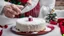 Placeholder: cutting the christmas cake, a piece is missing, on top there is powdered sugar and a christmas ornament