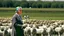 Placeholder: George w bush at podium speaking to large field of sheep