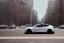 Placeholder: A Tesla 'Model S' is drifting at high speeds, near the Flatiron Building in Manhattan. (CINEMATIC, WIDE ANGLE LENS, PHOTO REAL)