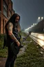 Placeholder: a very disappointed member with guitar case, dark long hair and beard of a death hard rock band who has been kicked out of a rehearsal space in Sweden, old factories style with bricks, deserted place overgrown plants and grass, he stands outside in the rain and cries, street lamps shining, raindrops, wind, empty roads and cycle paths next to it, really bad weather