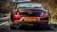 Placeholder: bentley mustang rear view fast on road