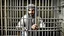 Placeholder: rich prisoner behined cage arab