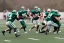 Placeholder: Boston Shamrocks Football team playing against the Toronto Rifles Football team,vintage, hyper-realistic, in color, Boston in green, Toronto in Red