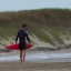 Placeholder: Whenever he saw a red flag warning at the beach he grabbed his surfboard.