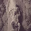 Placeholder: giant sleeping on his back on a stone slab in a cathedral cavern