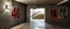 Placeholder: background of wall(wet textured concrete, gray, old, cracked, stained, 1 wall light) from underground parking, hong kong style, a large number "46" painted on left(old faded paint), at middle is an opening into an area with stairway(poorly lit), cyberpunk, to the right of opening is a faded keith haring poster