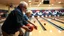 Placeholder: elderly men and women ten-pin bowling, detailed colour photograph