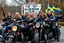 Placeholder: a very hard and tuff motorcycle young gang with viking hair, not old, posing with their Harley Davidsson bikes, some of them holding guns and shotguns, a logo sign with Falköpings HD Club, "Fearless sinners" Skulls and bones, skeletons and fire, Sweden vikings DEMONS, Swedish flags on bikes