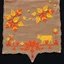 Placeholder: an autumn colored textured cloth embroidered ornamental leaves and cattle, pointed bottom, on dark background