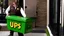 Placeholder: UPS delivery man in green crocs is at the gate