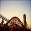 Placeholder: kodachrome of a roller coaster, evening light, relaxing, vintage