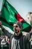 Placeholder: A young man stands and holds a large Palestinian flag in his hands and waves it while wearing a keffiyeh