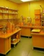 Placeholder: A yellowish orange colored laboratory with machines painted by Henri-Robert Bresil