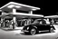 Placeholder: Digital Photo, 1950s, perfect perspective, night scene, a black Volkswagen beetle in front of a gas station pump, hyper realistic, hyper detailed, intricated, Frank Lloyd Wright