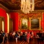 Placeholder: Party in a schloss, cheering people, Austrian aesthetic, warm colors, wooden floor, green walls, red, chiaroscuro, 8k, HD, cinematography, photorealistic, Cinematic, Color Grading, Ultra-Wide Angle, Depth of Field, hyper-detailed, beautifully color-coded, insane details, intricate details, beautifully color graded, Cinematic, Color Grading, Editorial Photography, Depth of Field, DOF, Tilt Blur, White Balance, 32k, Super-Resolution, Megapixel, ProPhoto RGB, VR, Halfrear Lighting, Backlight