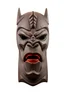 Placeholder: sculpture of a samourai warior head mask, oni, mouth open, angry face, totem form, wood