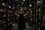 Placeholder: full-height shot of a woman in a tight black dress, holding up small glowing symbols, inside a magic book shop