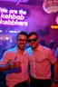Placeholder: An "Identical twins" performing at dance club, theyre name is "Martin and Mercurius" Happy and celebrity look, , Neon lights and smog, "We are the kebab brothers" big sign on the wall