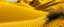 Placeholder: Golden yellow dunes with a cave designed in ancient Egyptian hieroglyphics painted by Diego Rivera