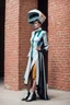 Placeholder: woman in retro-futurist costuming standing while leaning to the side against a brick pillar