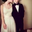 Placeholder: Russian short hair beautiful tomboy boyish boylike short man's haircut boyish features shortcut in black girlish nightgown in hotel wedding night