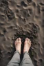 Placeholder: A toes looks dirty filled on the grey dark. Sands and dirt on a sands ground, view from the top