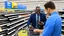 Placeholder: successful businessman man buys cellphone at walmart