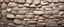 Placeholder: Stone wall. Light brown rock texture. Stone grunge backdrop. Rocky texture background with copy space for design. Web banner. Wide. Panoramic.