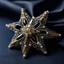 Placeholder: A stunning handmade brooch in the shape of a star, embroidered with dazzling beads, bugles, and crystals, rich gold and silver tones, an intricate yet bold design, the perfect blend of elegance and luxury, intricate reflections of light on the stones and sequins, set against a black satin fabric, sharp focus on the details with soft shadowed lighting creating a luxurious atmosphere