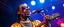 Placeholder: snoop dog glam rock in the style of sweet