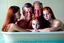 Placeholder: digital art of beautiful young auburn hair teenage girls with dad in the bedroom in a bathtub with grandpa hugging bare lips