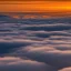 Placeholder: Sunrise over clouds