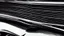 Placeholder: Photograph of a the front grill of a gorgeous, expensive, oldschool black muscle car with a big, black front grill, realistic, stylish, taken up close, symmetrical