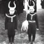 Placeholder: Creepy Old photo of children with horns and woollen masks