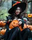 Placeholder: beautiful Asian woman in unique custom fashion witch style Happy Halloween,sitting biggest pumpkin Halloween ,sorrounded by puppets Halloween